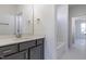 Bathroom features a vanity with a white countertop, a mirror, and a white tiled shower/tub combo at 3913 Berkeley Town Ln, Fuquay Varina, NC 27526