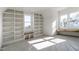 Bedroom featuring custom built-in shelving and sitting benches at 3913 Berkeley Town Ln, Fuquay Varina, NC 27526