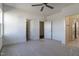 Bright bedroom with ceiling fan, and view to connected bathroom at 3913 Berkeley Town Ln, Fuquay Varina, NC 27526