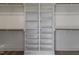 Bright closet featuring custom shelving, hanging rods, and organized storage solutions at 3913 Berkeley Town Ln, Fuquay Varina, NC 27526