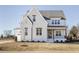 Beautiful two-story white painted brick home with professionally landscaped yard at 3913 Berkeley Town Ln, Fuquay Varina, NC 27526