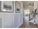 Beautiful foyer featuring hardwood floors, wainscoting, art and a staircase leading to the second floor at 3913 Berkeley Town Ln, Fuquay Varina, NC 27526