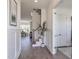 Elegant foyer with hardwood floors, paneled walls, and staircase, providing a welcoming entrance at 3913 Berkeley Town Ln, Fuquay Varina, NC 27526