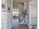 Inviting foyer with hardwood floors, wainscoting, and staircase, offering a glimpse into the dining area at 3913 Berkeley Town Ln, Fuquay Varina, NC 27526
