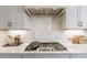Elegant kitchen with stainless steel appliances, white cabinetry, and quartz countertops at 3913 Berkeley Town Ln, Fuquay Varina, NC 27526