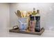 Kitchen countertop with stylish wooden utensils, oil bottles, and marble mortar and pestle at 3913 Berkeley Town Ln, Fuquay Varina, NC 27526