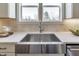 Farmhouse stainless steel kitchen sink with modern faucet and beautiful windows offering natural light at 3913 Berkeley Town Ln, Fuquay Varina, NC 27526