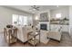 Bright living room featuring a fireplace, ceiling fan, and hardwood floors at 3913 Berkeley Town Ln, Fuquay Varina, NC 27526
