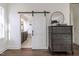 Modern main bedroom with sliding barn door to ensuite bathroom at 3913 Berkeley Town Ln, Fuquay Varina, NC 27526