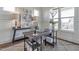 Well-appointed home office with a sturdy desk, chic decor, and a view of the outdoors at 3913 Berkeley Town Ln, Fuquay Varina, NC 27526