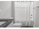 Clean bathroom features neutral colors and shower/tub combination at 40 Thunder Valley Ct, Lillington, NC 27546