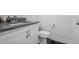 Cozy half-bath with granite countertop, a toilet, and blue accent rug at 40 Thunder Valley Ct, Lillington, NC 27546