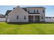 Charming two-story home featuring a screened-in porch and well-maintained lawn at 40 Thunder Valley Ct, Lillington, NC 27546