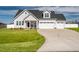 Beautiful two-story home with a three-car garage and manicured front lawn at 40 Thunder Valley Ct, Lillington, NC 27546
