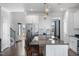 Spacious kitchen features a large island with granite countertop, stainless steel appliances, and white cabinetry at 40 Thunder Valley Ct, Lillington, NC 27546