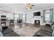 Open floor plan featuring modern living room, dining area and kitchen. Fireplace and TV above mantle at 40 Thunder Valley Ct, Lillington, NC 27546