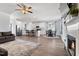 Open floor plan featuring modern living room, dining area and kitchen. Fireplace and TV above mantle at 40 Thunder Valley Ct, Lillington, NC 27546