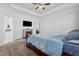 This primary bedroom includes a fireplace, tray ceiling and ensuite bathroom at 40 Thunder Valley Ct, Lillington, NC 27546