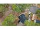 Aerial view of a home nestled among mature trees in a residential neighborhood at 402 Shannonford Ct, Wake Forest, NC 27587