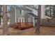 Exterior backyard with a wooden deck and green siding at 402 Shannonford Ct, Wake Forest, NC 27587