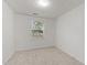Bright bedroom featuring a window with neutral walls and carpet at 402 Shannonford Ct, Wake Forest, NC 27587