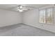 Spacious bedroom with neutral walls, carpet, window, and ceiling fan at 402 Shannonford Ct, Wake Forest, NC 27587