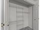 White closet equipped with multiple shelving racks at 402 Shannonford Ct, Wake Forest, NC 27587