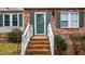 Close-up of the home's front entrance with brick steps and green shutters at 402 Shannonford Ct, Wake Forest, NC 27587