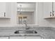 Bright kitchen featuring a window over the sink and granite countertops at 402 Shannonford Ct, Wake Forest, NC 27587