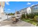 Backyard patio featuring an outdoor table and chairs, perfect for entertaining at 4052 Dunkirk Dr, Burlington, NC 27215