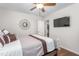 Bedroom featuring a ceiling fan, TV, and access to a well-lit living area at 4052 Dunkirk Dr, Burlington, NC 27215