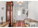 Bright foyer featuring hardwood flooring, a staircase, and elegant decor, leading to the rest of the home at 4052 Dunkirk Dr, Burlington, NC 27215