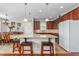 Spacious kitchen featuring granite counters, stainless appliances, and adjacent dining area at 4052 Dunkirk Dr, Burlington, NC 27215