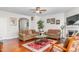 Comfortable living room showcases a fireplace, hardwood flooring, neutral paint, and an open, airy layout at 4052 Dunkirk Dr, Burlington, NC 27215