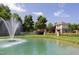 Scenic view of the community pond with a fountain, surrounded by lush landscaping and a charming gazebo at 4052 Dunkirk Dr, Burlington, NC 27215