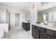 Bright bathroom boasts double sinks, dark cabinetry, and a walk-in shower at 428 Boulder Point Dr, Chapel Hill, NC 27516