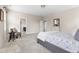 Spacious bedroom with neutral carpet, chair, dresser, and access to the ensuite bathroom at 428 Boulder Point Dr, Chapel Hill, NC 27516