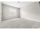 Spacious bedroom with neutral carpet, one bright window, and neutral walls at 428 Boulder Point Dr, Chapel Hill, NC 27516
