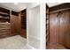 Walk-in closet features custom wood shelving, drawers, and full-length mirror at 428 Boulder Point Dr, Chapel Hill, NC 27516