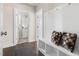 Functional entryway with built-in bench, storage, and access to a half-bathroom at 428 Boulder Point Dr, Chapel Hill, NC 27516