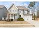 Charming two-story home with a welcoming front porch and attached two-car garage at 428 Boulder Point Dr, Chapel Hill, NC 27516