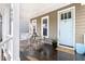 Cozy front porch features outdoor seating and a stylish blue front door at 428 Boulder Point Dr, Chapel Hill, NC 27516
