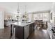 Open-concept kitchen with island flowing into the living and dining areas, ideal for entertaining at 428 Boulder Point Dr, Chapel Hill, NC 27516