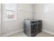 Laundry room features side-by-side washer and dryer and wire shelf at 428 Boulder Point Dr, Chapel Hill, NC 27516