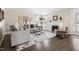 Cozy living room with a fireplace, ample seating, and a large window for natural light at 428 Boulder Point Dr, Chapel Hill, NC 27516