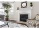 Living room detail highlighting the fireplace and mantel, with natural light from the window at 428 Boulder Point Dr, Chapel Hill, NC 27516