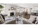 Spacious living room with modern decor, a fireplace, and an open layout connecting to the dining area at 428 Boulder Point Dr, Chapel Hill, NC 27516