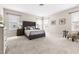 Bright bedroom with neutral carpet, large bed, and furnishings at 428 Boulder Point Dr, Chapel Hill, NC 27516