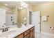 Bright bathroom with double sinks, walk-in shower, and neutral finishes at 48 Grandwood Cir, Durham, NC 27712