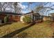 Serene backyard with lush greenery, mature trees, and a charming screened porch at 513 Princeton St, Raleigh, NC 27609